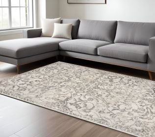 9' X 13' Ivory And Brown Floral Medallion Distressed Area Rug