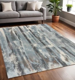 5' X 8' Teal Blue And White Abstract Area Rug