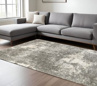 7' X 10' Gray And Ivory Distressed Abstract Area Rug