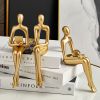 Gold Abstract Seated Figure Sculpture